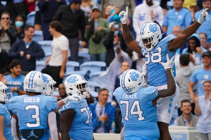 Oct 9, 2021; Chapel Hill, North Carolina, USA; North Carolina Tar Heels tight end Kamari Morales (88) is congratulated by offensive lineman Jordan Tucker (74) after his second half touchdown catch against the Florida State Seminoles at Kenan Memorial Stadium. Mandatory Credit: James Guillory-USA TODAY Sports